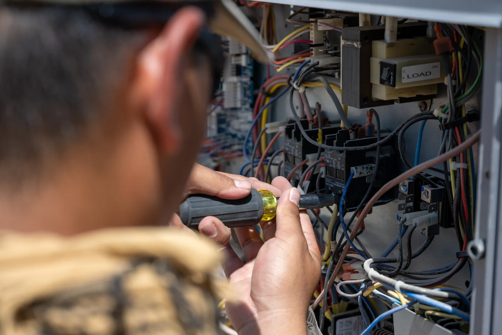 HVAC service technician working on equipment